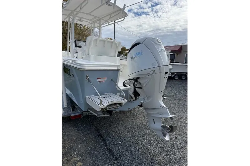 Slide: The Image of 2022 Parker 1801 Center Console boat with Garmin navigation system and steering wheel. - 3