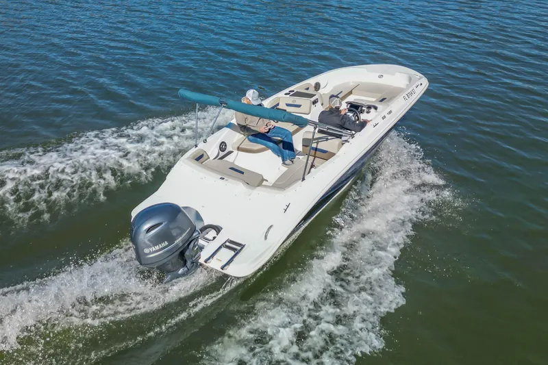 Slide: The Image of 2021 Hurricane Center Console SS 211 OB boat cruising on water. - 13