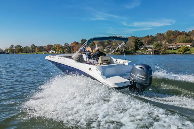 Slide: The Image of 2021 Hurricane Center Console SS 211 OB cruising on a scenic lake. - 14