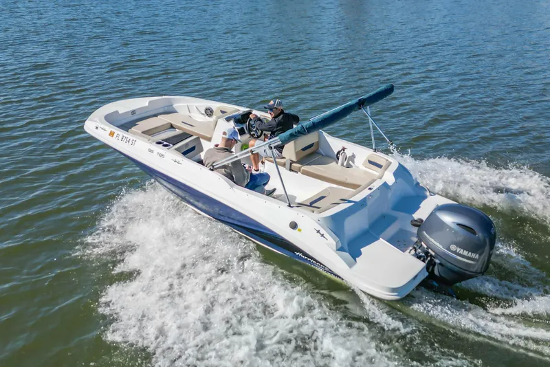 Slide: The Image of 2021 Hurricane Center Console SS 211 OB boat cruising on water with Yamaha outboard motor. - 15