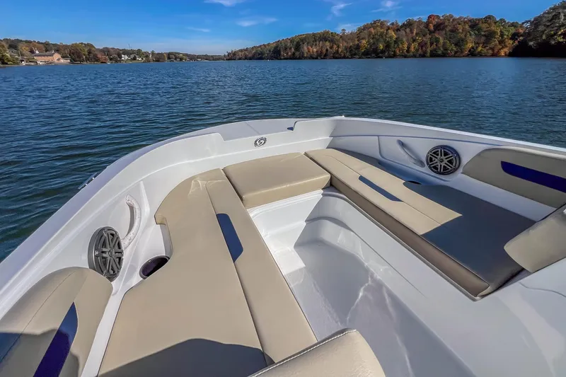 Slide: The Image of 2021 Hurricane Center Console SS 211 OB boat on a serene lake with scenic views. - 19