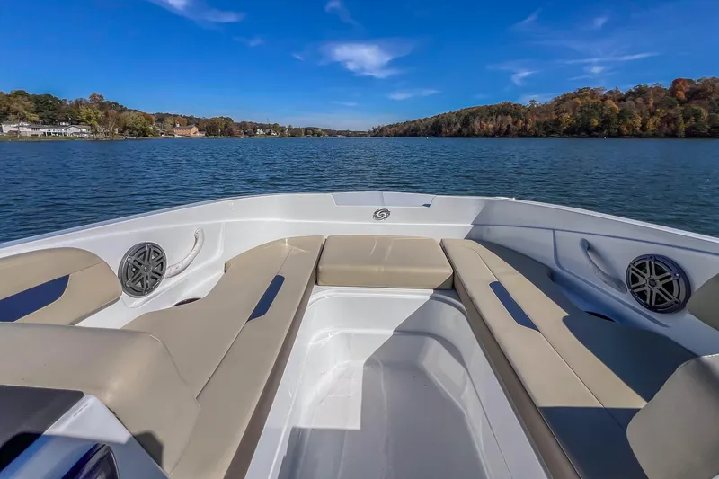 Slide: The Image of 2021 Hurricane Center Console SS 211 OB on a serene lake with clear blue skies. - 20