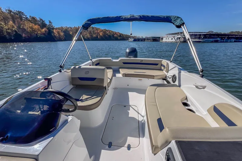 Slide: The Image of 2021 Hurricane Center Console SS 211 OB boat on a scenic lake. - 21