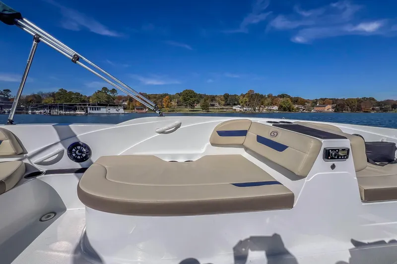 Slide: The Image of 2021 Hurricane Center Console SS 211 OB boat interior with beige seating on a sunny day. - 25
