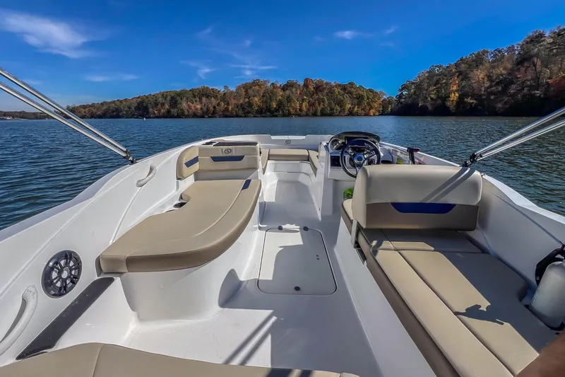 Slide: The Image of 2021 Hurricane Center Console SS 211 OB boat on a scenic lake with autumn trees. - 26