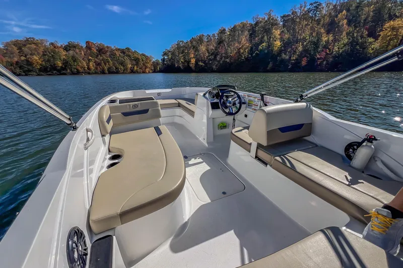 Slide: The Image of 2021 Hurricane Center Console SS 211 OB boat on a scenic lake with autumn trees. - 27
