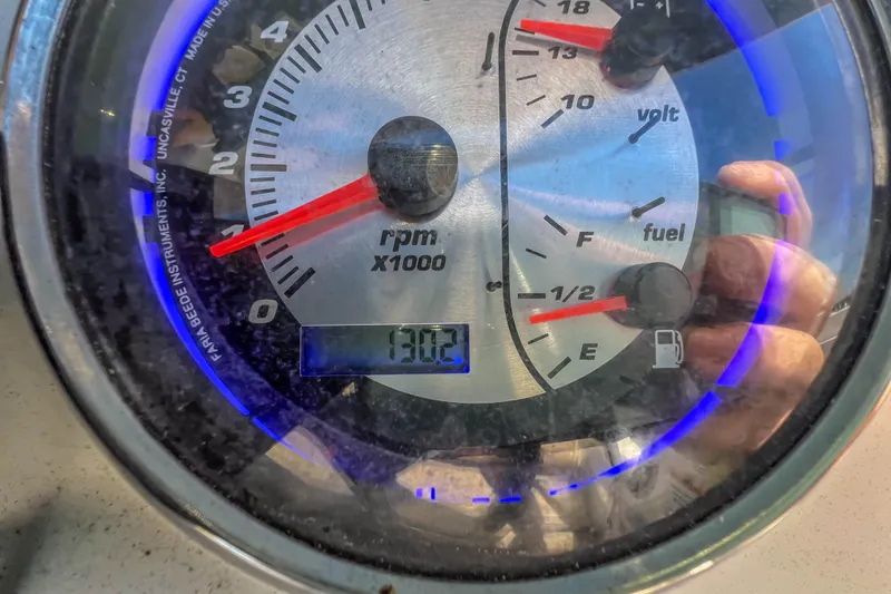 Slide: The Image of Close-up of 2021 Hurricane Center Console SS 211 OB gauge showing RPM, voltage, and fuel levels. - 30