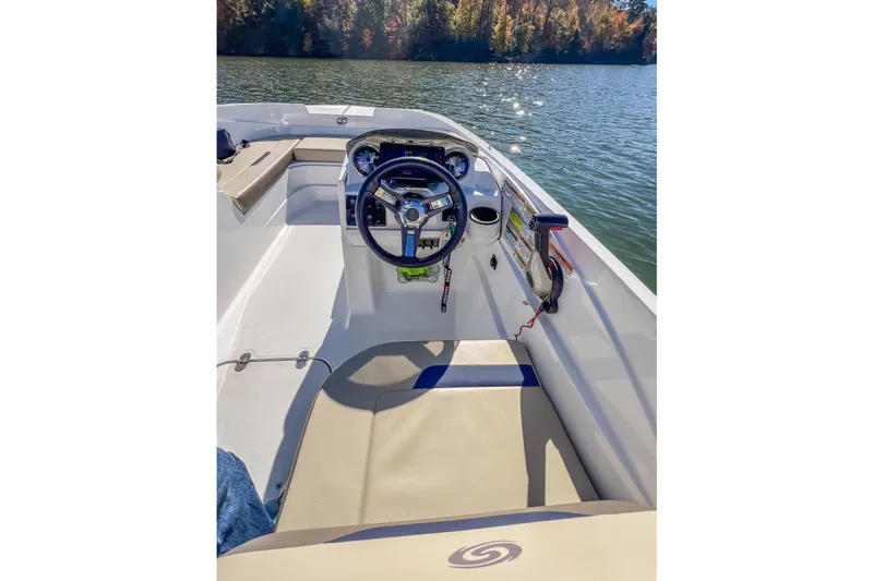 Slide: The Image of 2021 Hurricane Center Console SS 211 OB boat interior on a sunny lake. - 31
