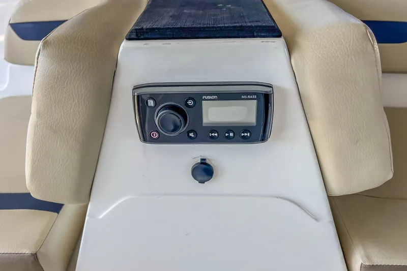Slide: The Image of 2021 Hurricane Center Console SS 211 OB boat stereo system with beige seating. - 33