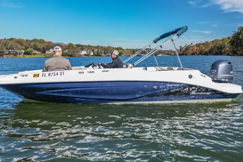 Slide: The Image of 2021 Hurricane Center Console SS 211 OB boat on a scenic lake. - 6