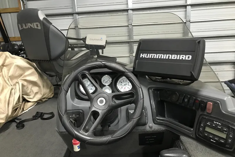 Slide: The Image of 2015 Lund 1675 Impact boat dashboard with Humminbird and Garmin electronics. - 4