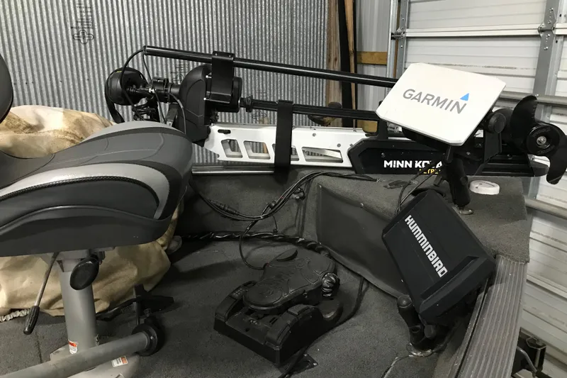 Slide: The Image of 2015 Lund 1675 Impact boat interior with Garmin and Humminbird electronics. - 5