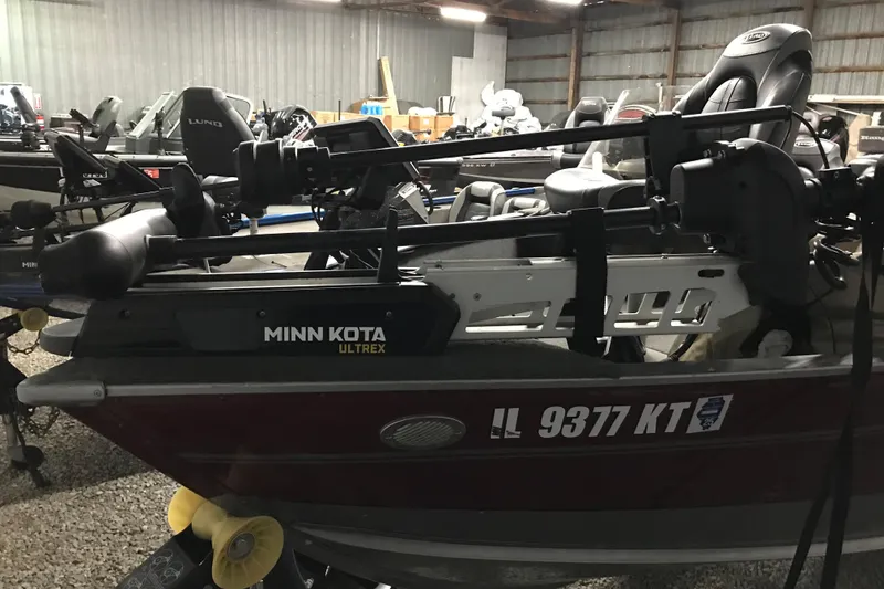 Slide: The Image of 2015 Lund 1675 Impact boat with Minn Kota Ultrex motor in storage facility. - 6