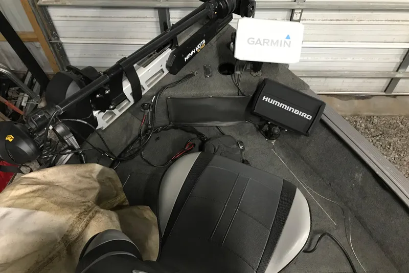 Slide: The Image of 2015 Lund 1675 Impact boat interior with Garmin and Humminbird electronics. - 8