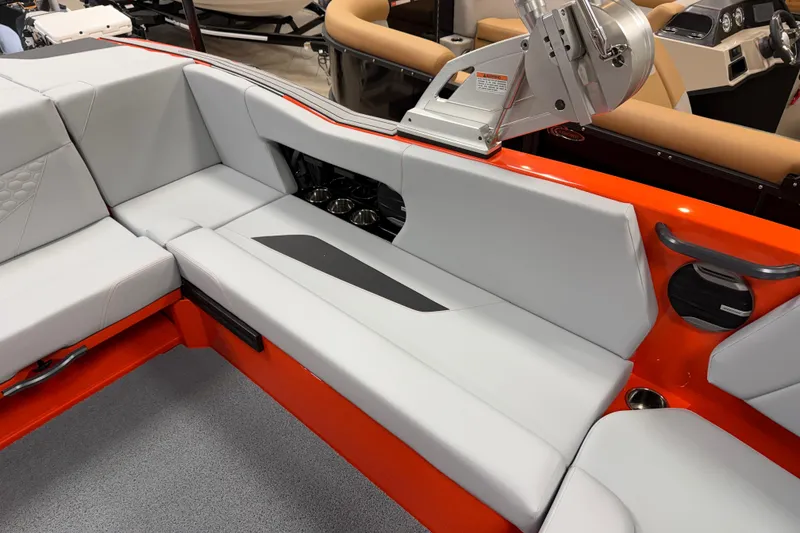 Slide: The Image of 2026 MasterCraft NXT22 boat interior with white seating and orange accents. - 5