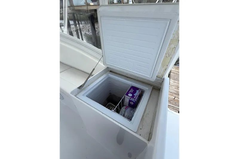 Slide: The Image of Open storage compartment on 2006 Custom Carolina Heritage Express boat. - 11