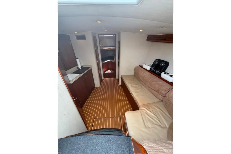Slide: The Image of Interior of 2006 Custom Carolina Heritage Express boat with cozy seating and kitchenette. - 26