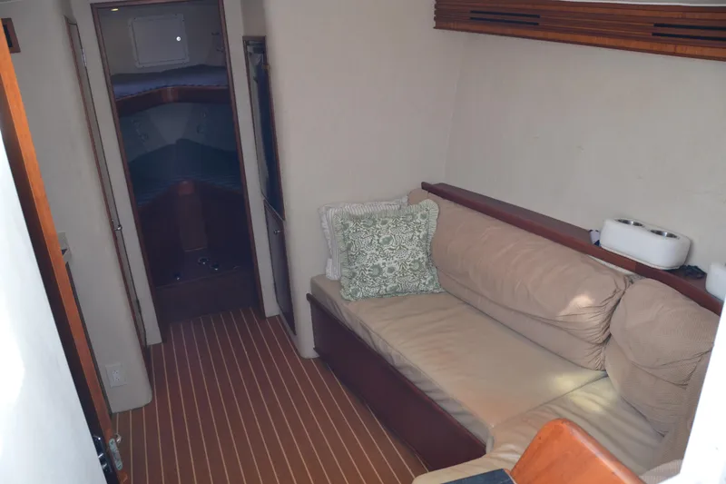 Slide: The Image of 2006 Custom Carolina Heritage Express yacht interior with cozy seating and elegant wood finishes. - 27