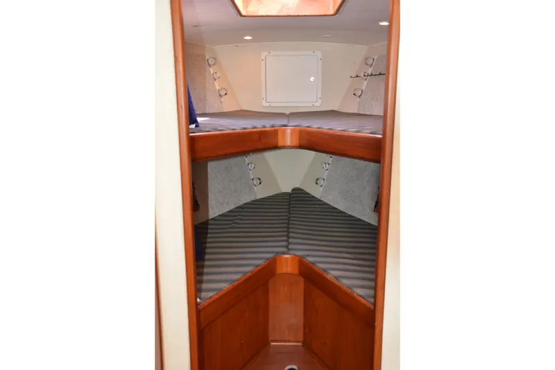 Slide: The Image of 2006 Custom Carolina Heritage Express boat interior with wooden bunk beds. - 28