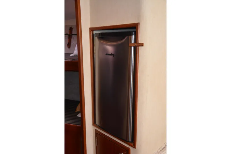 Slide: The Image of 2006 Custom Carolina Heritage Express interior with compact stainless steel refrigerator. - 29