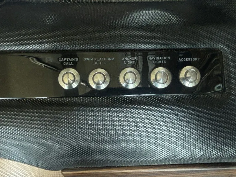 Slide: The Image of Control panel of a 2014 Cobalt A25 boat with labeled buttons. - 14