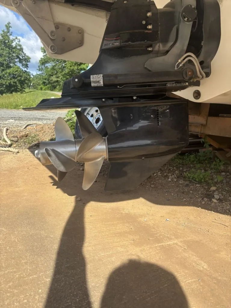 Slide: The Image of 2014 Cobalt A25 boat propeller and outdrive on a sunny day. - 23