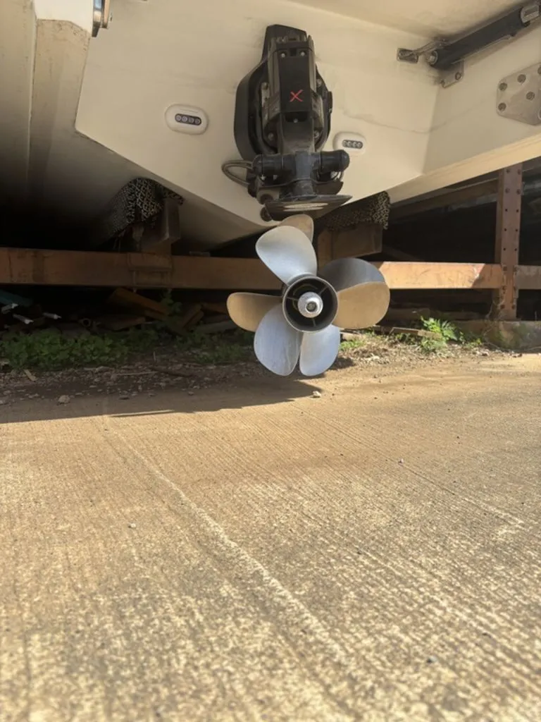 Slide: The Image of 2014 Cobalt A25 boat propeller on dry dock, close-up view. - 24