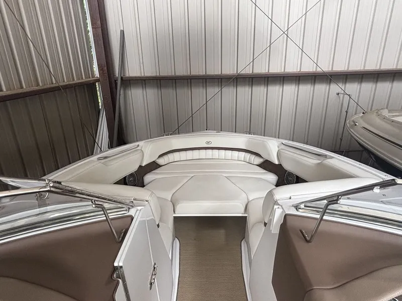 Slide: The Image of 2014 Cobalt A25 boat interior with white seating in storage. - 8