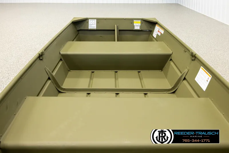 Slide: The Image of 2026 Lund 1040 boat interior with bench seats, displayed in showroom. - 15