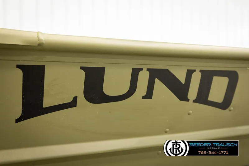 Slide: The Image of Close-up of 2026 Lund 1040 boat with logo and Reeder-Trausch Marine contact details. - 19