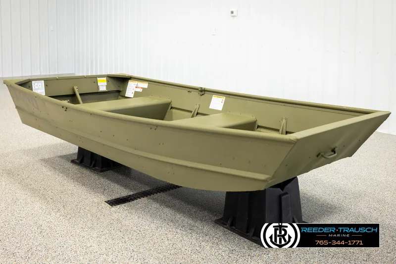 Slide: The Image of 2026 Lund 1040 boat displayed indoors on stands, featuring a simple, durable design. - 2