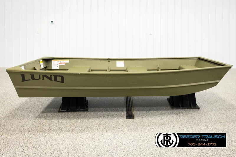 Slide: The Image of 2026 Lund 1040 boat in showroom, olive green, side view on display stands. - 3