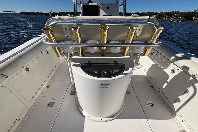 Slide: The Image of 2006 Century 2600 Center Console boat with rod holders on a sunny day. - 12