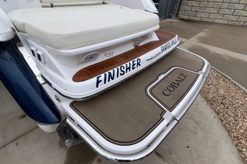 Slide: The Image of 2022 Cobalt R35 boat with "Finisher" branding on the deck. - 11