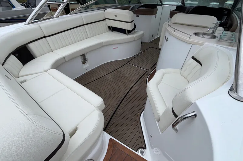 Slide: The Image of Luxurious interior of 2022 Cobalt R35 boat with white seating and wood flooring. - 14