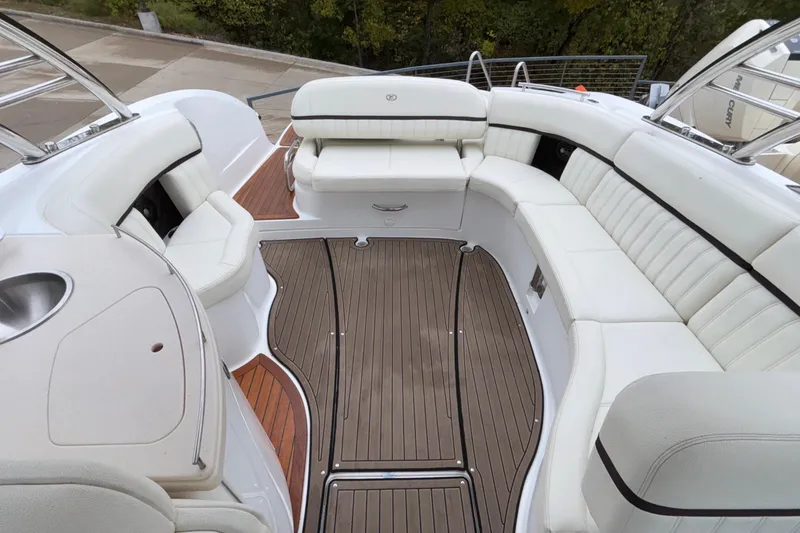 Slide: The Image of Luxurious 2022 Cobalt R35 boat interior with elegant white seating and wooden flooring. - 18