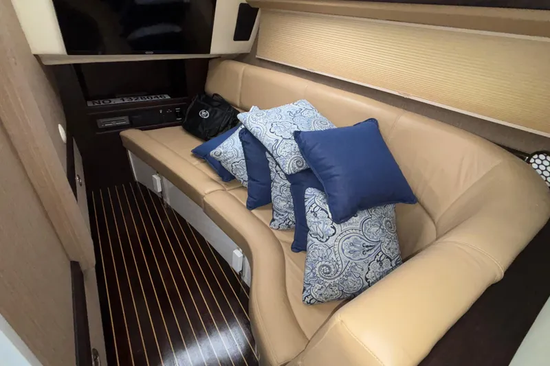 Slide: The Image of Luxurious interior of 2022 Cobalt R35 with beige seating and decorative pillows. - 23