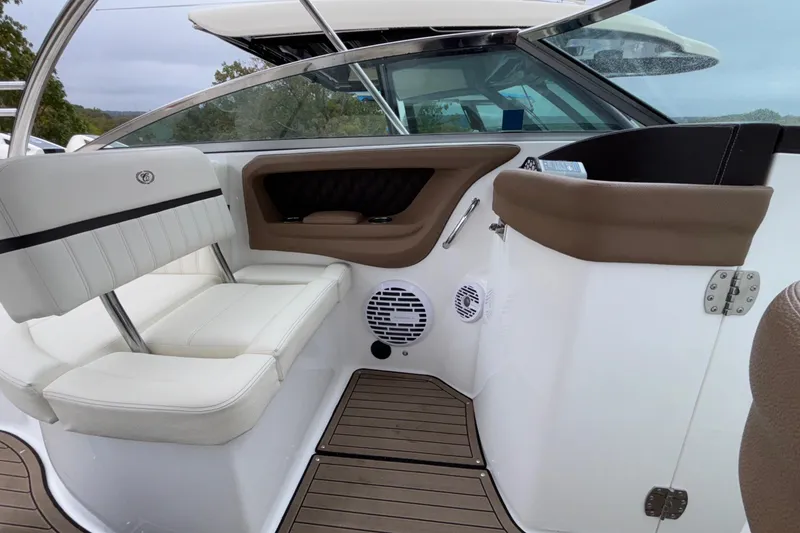 Slide: The Image of Interior of 2022 Cobalt R35 boat with white seating and wood flooring. - 24
