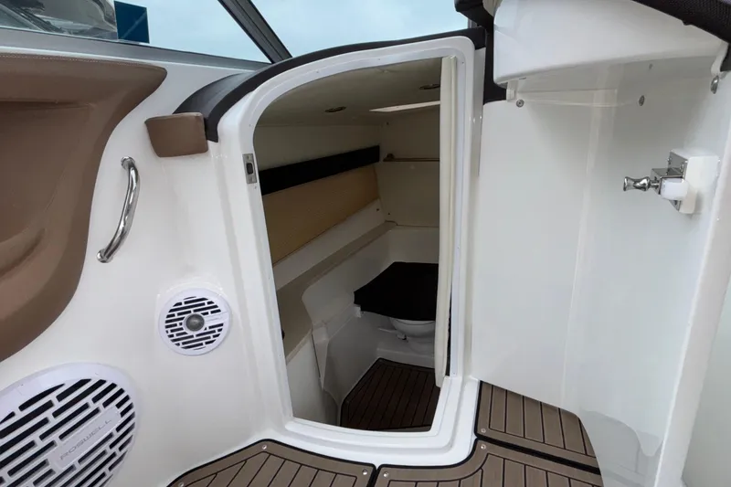 Slide: The Image of 2022 Cobalt R35 boat interior cabin with wood flooring and modern amenities. - 25