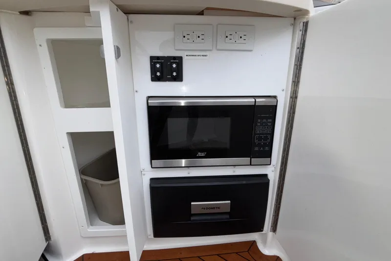 Slide: The Image of 2022 Cobalt R35 interior with microwave and storage cabinet. - 28