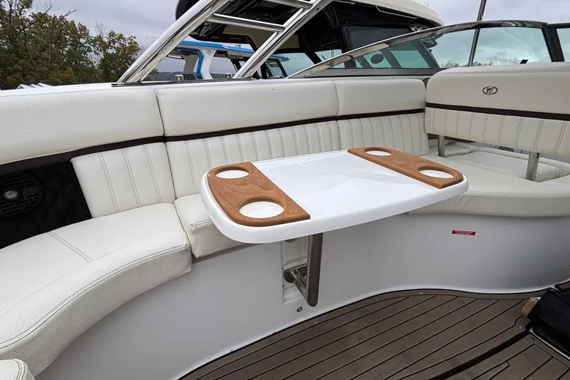 Slide: The Image of Luxurious seating area on 2022 Cobalt R35 boat with wooden cup holders. - 35
