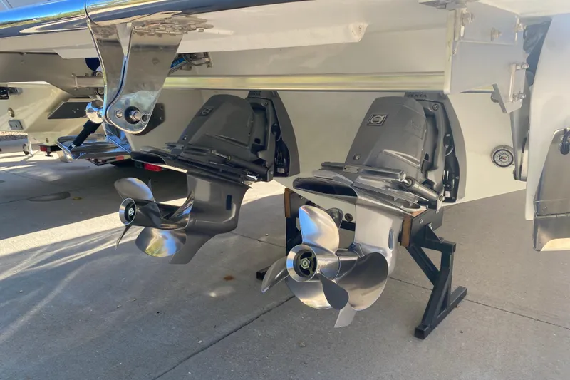 Slide: The Image of 2022 Cobalt R35 boat with dual propellers on a concrete surface. - 4