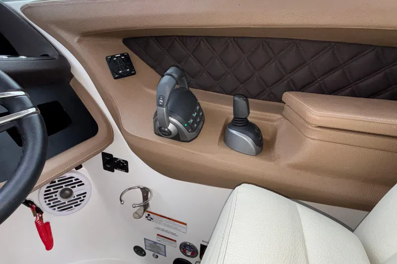 Slide: The Image of Interior of 2022 Cobalt R35 boat with steering and control panel. - 50