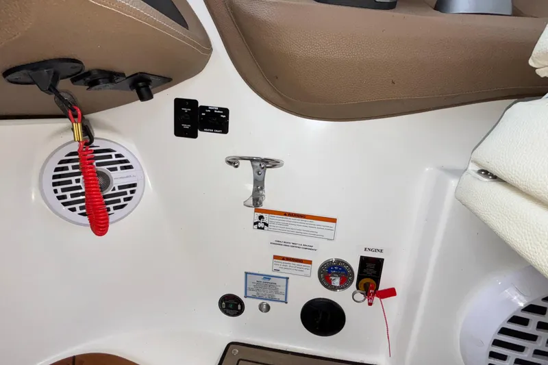 Slide: The Image of Interior of a 2022 Cobalt R35 boat with control panel and safety features. - 51