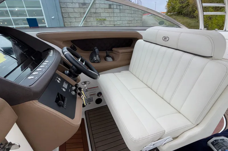 Slide: The Image of Interior of 2022 Cobalt R35 boat with white seating and modern dashboard controls. - 52