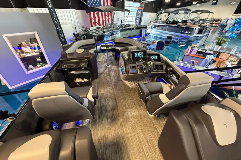 Slide: The Image of 2026 Tahoe Pontoon Cascade Cruise Rear Bench interior with modern seating and control panel. - 12