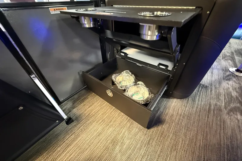 Slide: The Image of 2026 Tahoe Pontoon Cascade Cruise Rear Bench with storage drawer and cup holders. - 13