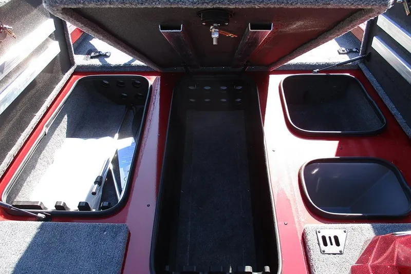 Slide: The Image of 2026 Ranger RT188P Fishing boat storage compartments with open lids, showcasing interior space. - 13