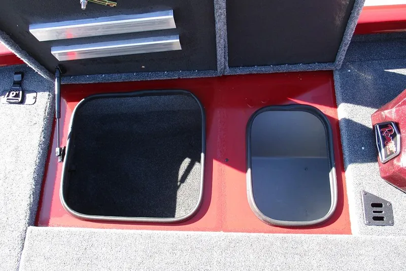 Slide: The Image of 2026 Ranger RT188P Fishing boat storage compartments with carpeted interior and red exterior. - 15