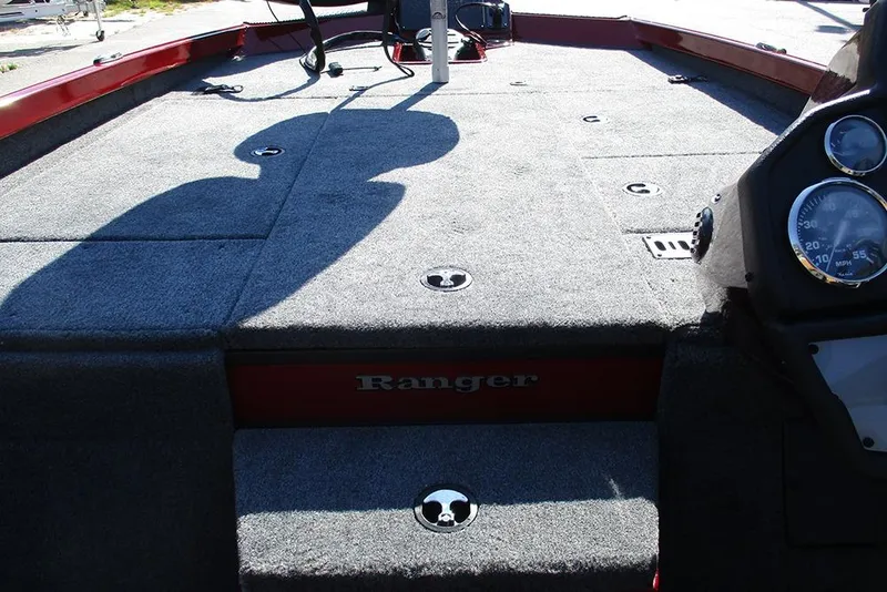 Slide: The Image of 2026 Ranger RT188P Fishing boat interior with carpeted deck and control panel. - 16